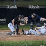 Baseball Player Slides Into Home Plate