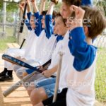 Side view little league baseball team cheering