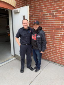 Thornhill Baseball President Michael Weiser with a member of the fire department.